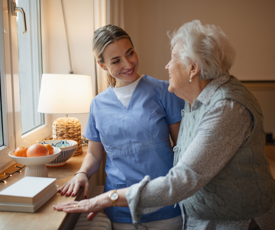 A caregiver supporting a senior with dementia outdoors.